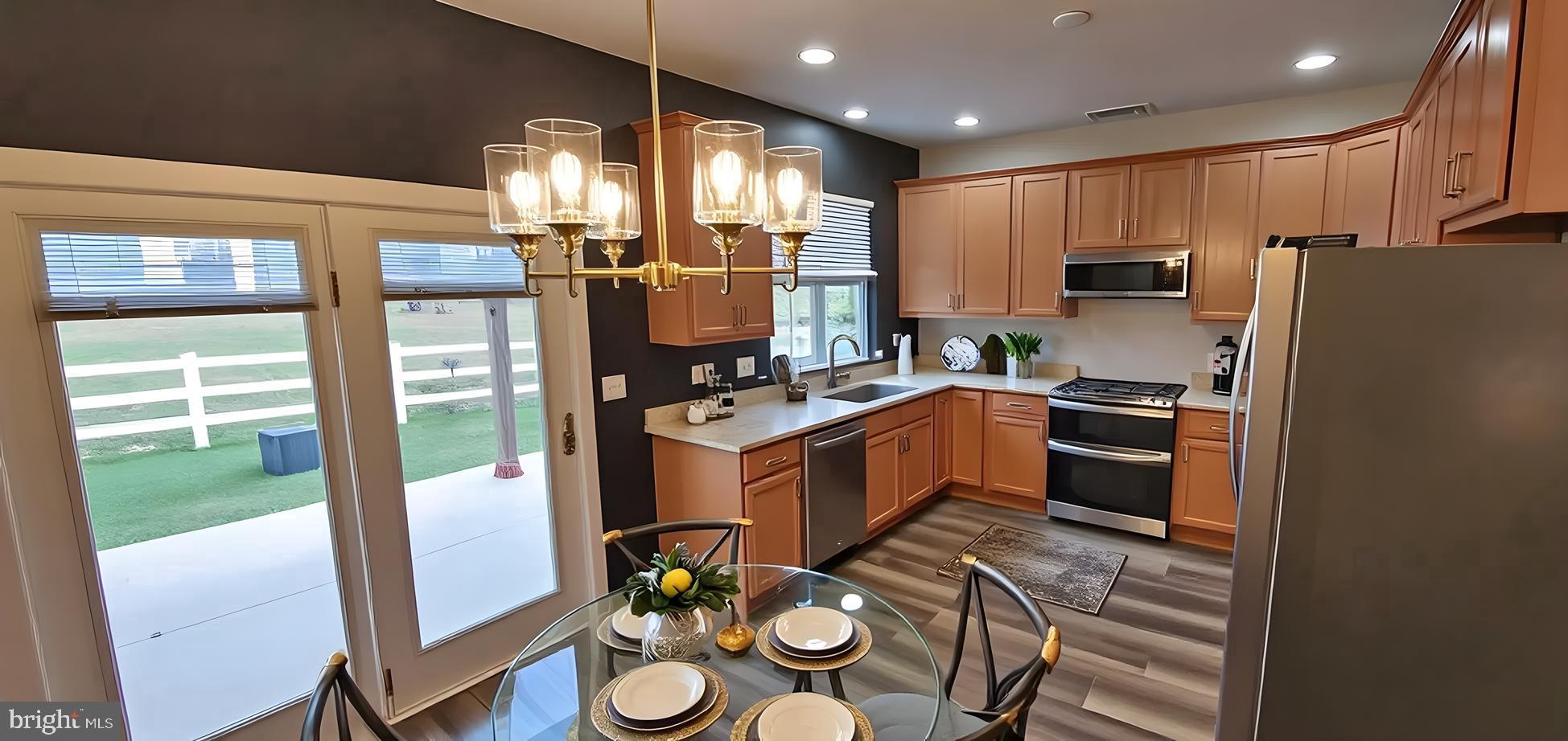 919 Lansdowne Road Middletown, DE 19709 - Photo 5 of 9 a kitchen that has a lot of cabinets a sink and appliances in it