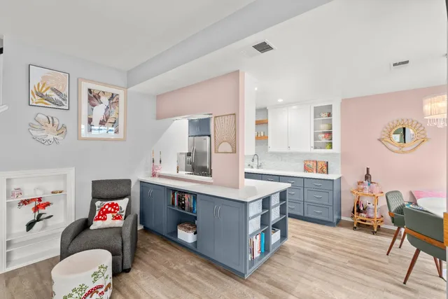 a room with a workspace and a couch