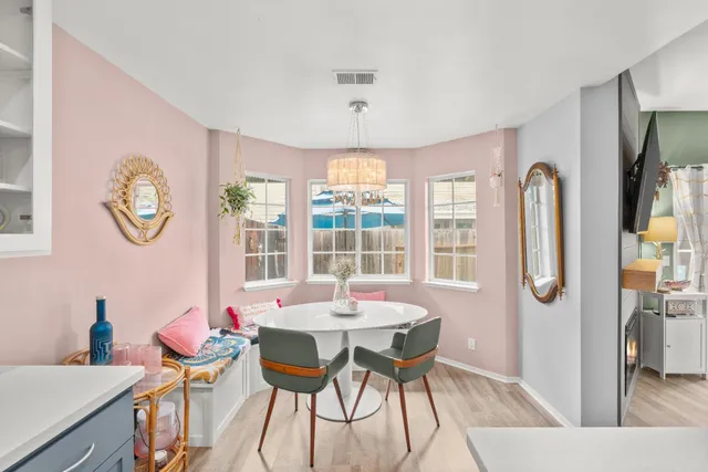 a kitchen with a refrigerator and a stove top oven