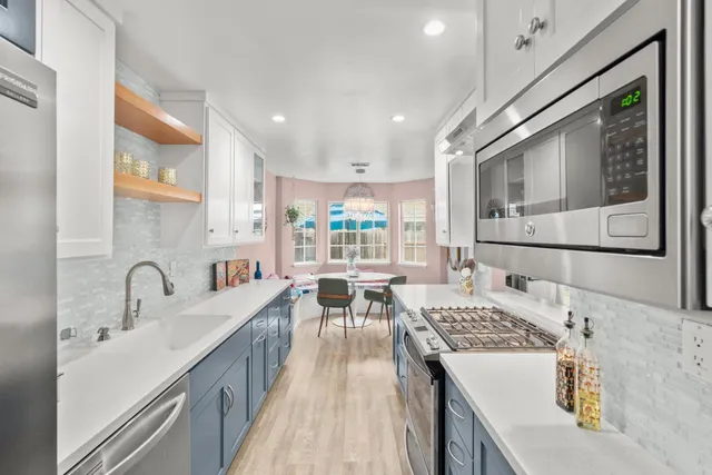 a living room with furniture and stairs