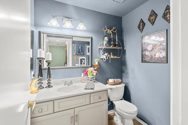 a bedroom with a bed a couch and dresser