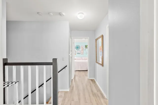 a bathroom with a sink vanity mirror and toilet