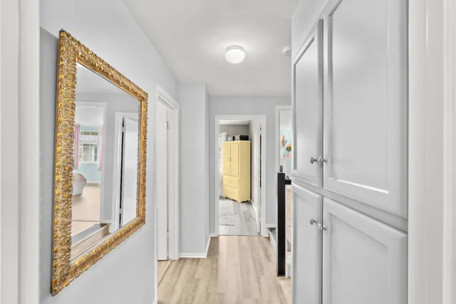 a view of living room kitchen with furniture and flat screen tv
