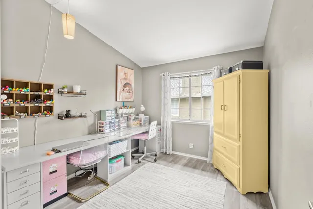a bathroom with a sink mirror and vanity