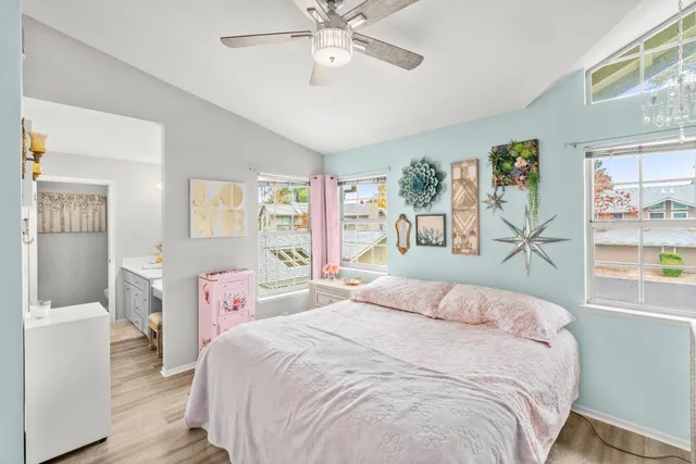 a view of walk in closet with clothes