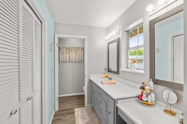 a view of a backyard with a table and chairs and potted plants