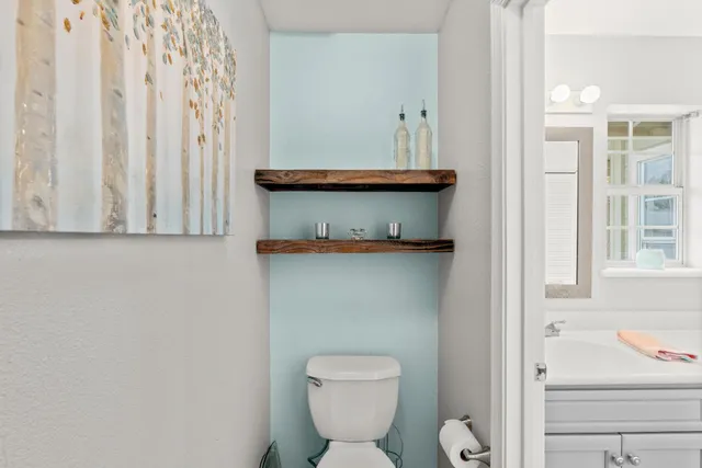 an aerial view of a house with a swimming pool