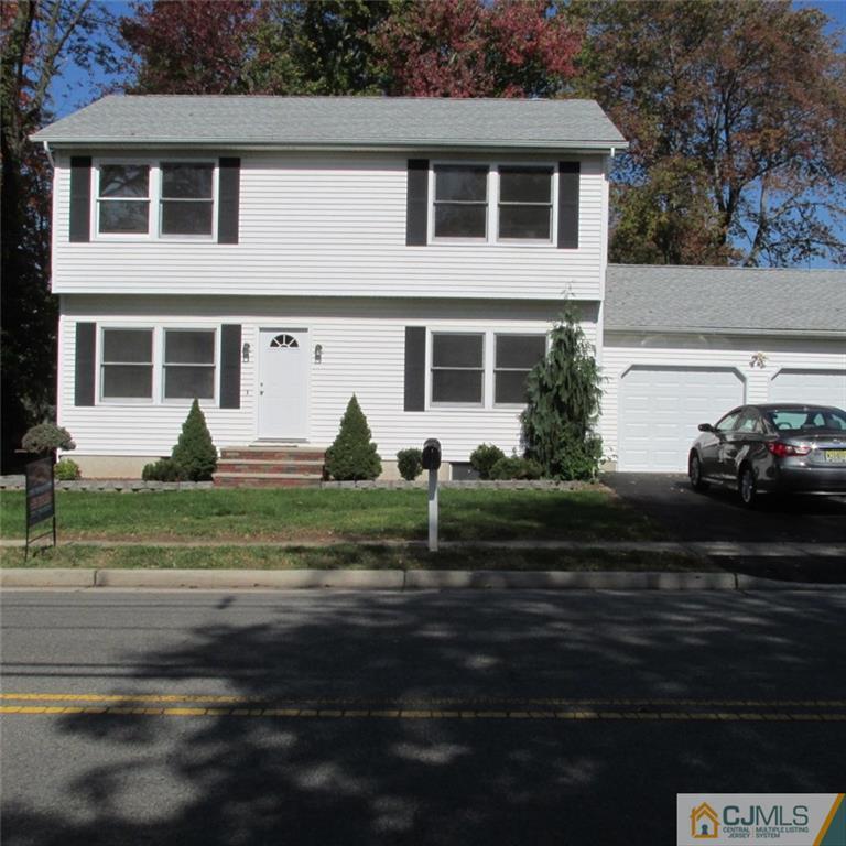 738 New Dover Road Edison, NJ 08820 - Photo 1 of 9 a front view of a house with a garden