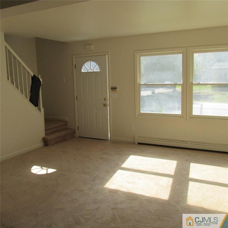 738 New Dover Road Edison, NJ 08820 - Photo 5 of 9 an empty room with windows