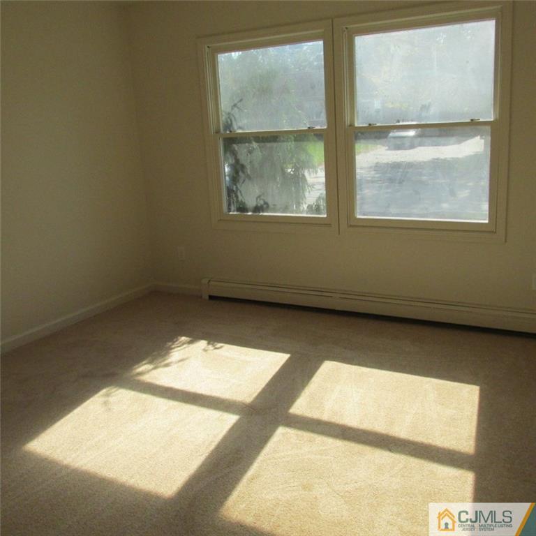 738 New Dover Road Edison, NJ 08820 - Photo 9 of 9 a view of an empty room with a window