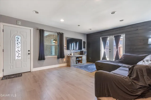 a living room with furniture and a window