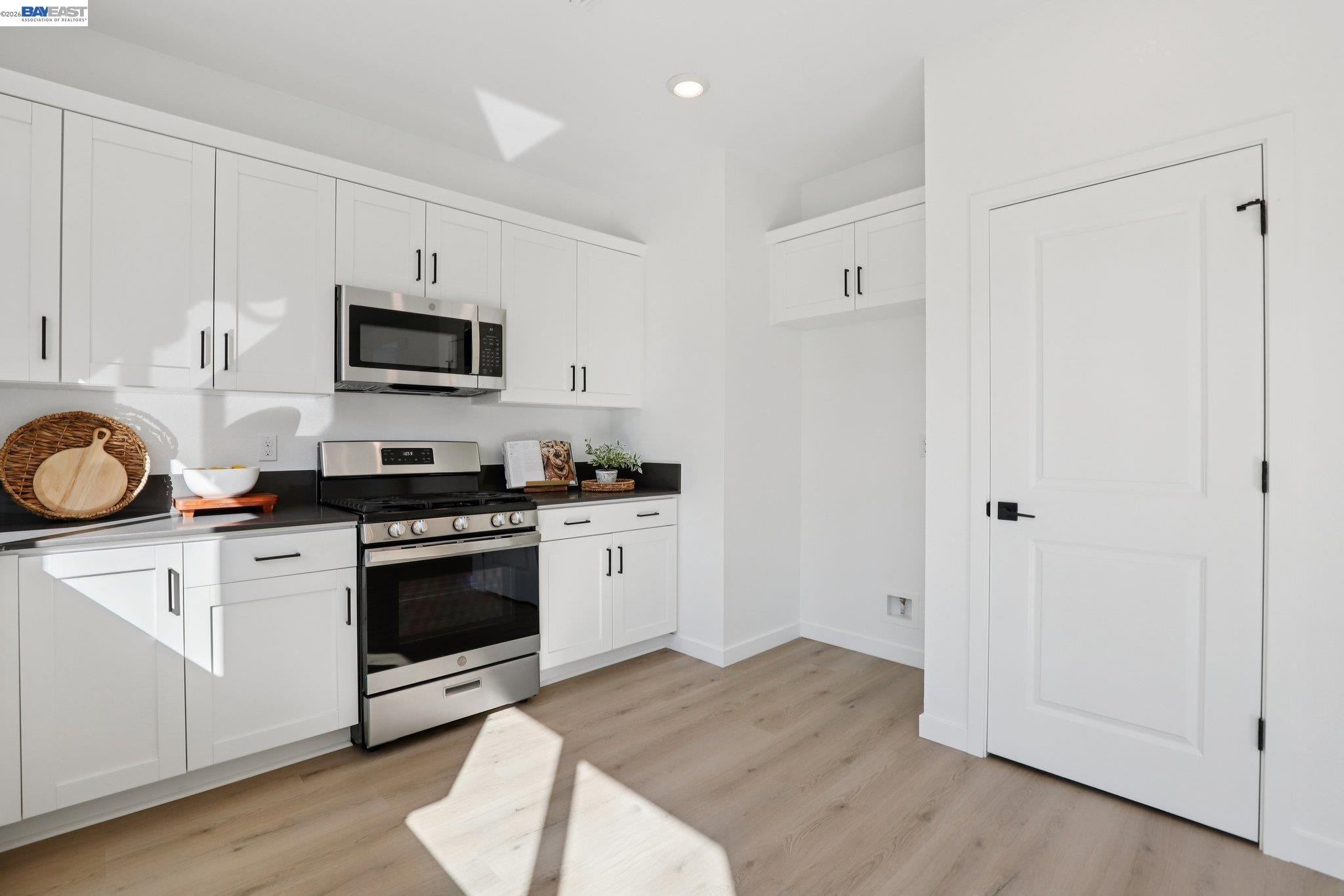 856 Pecan Tree Lane Galt, CA 95632 - Photo 12 of 30 a kitchen with cabinets stainless steel appliances and wooden floor