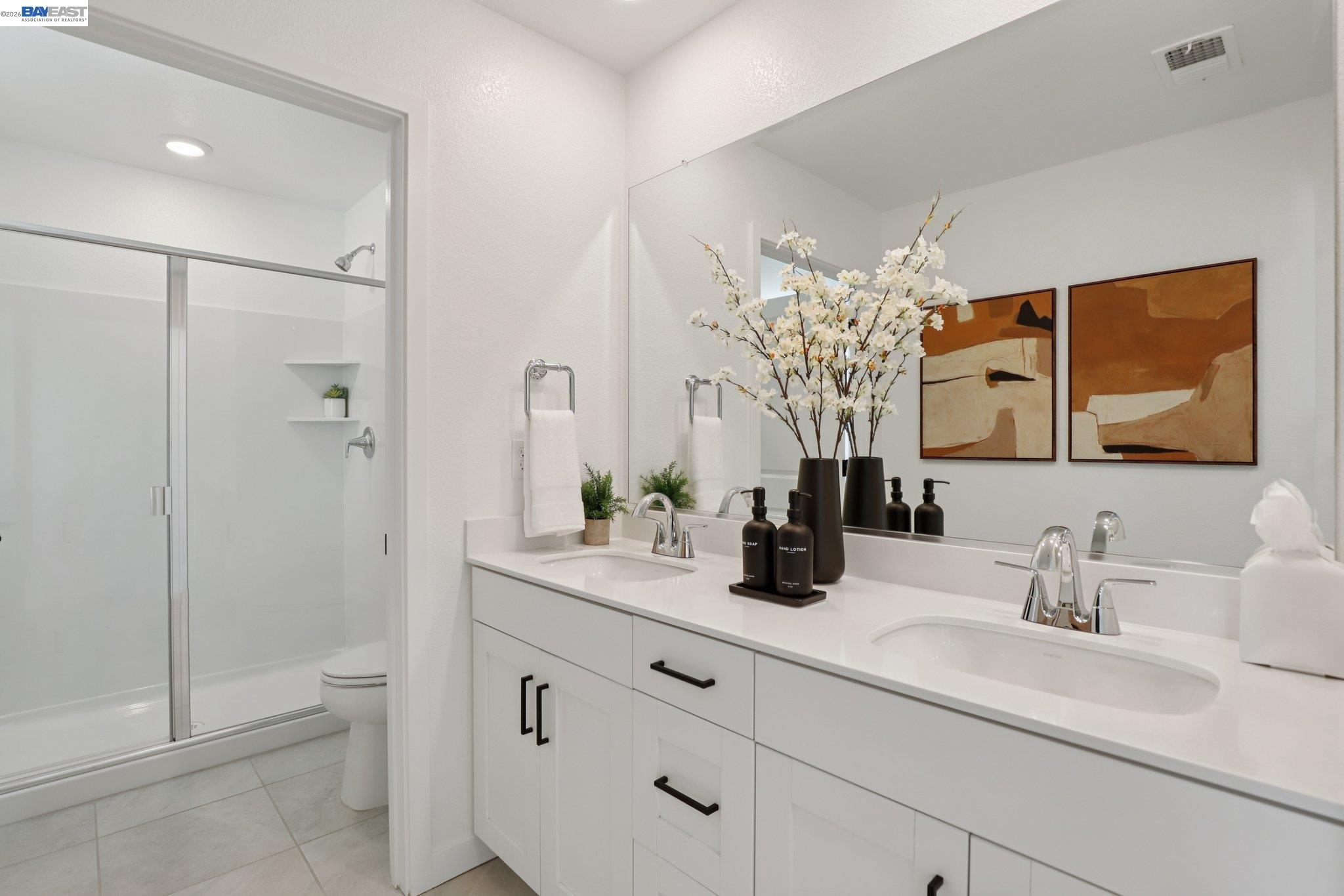 856 Pecan Tree Lane Galt, CA 95632 - Photo 22 of 30 a bathroom with a double vanity sink toilet and shower