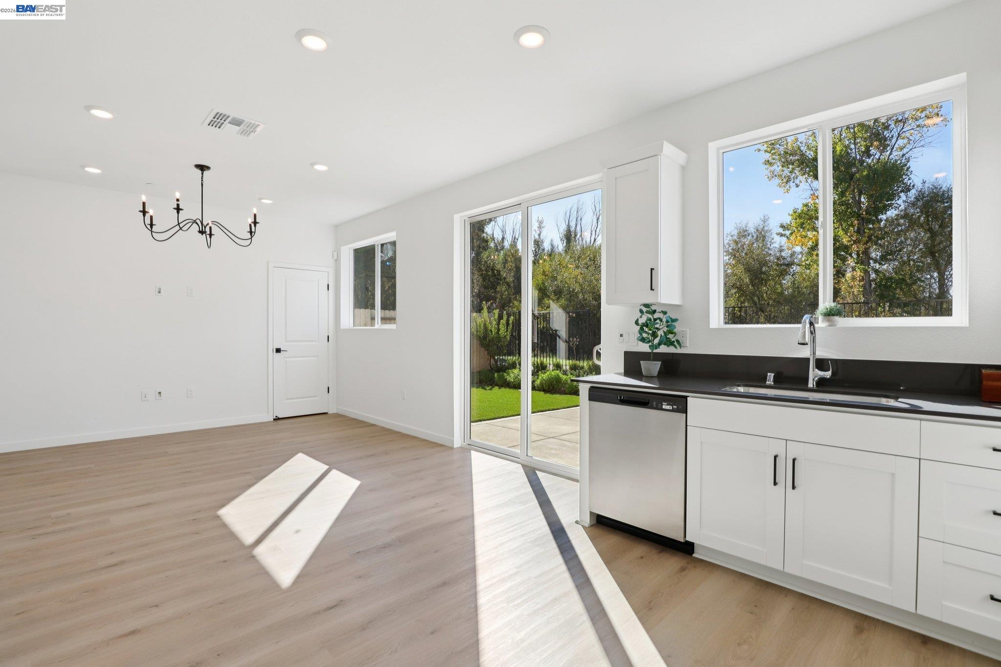 856 Pecan Tree Lane Galt, CA 95632 - Photo 8 of 30 a large white kitchen with a large window