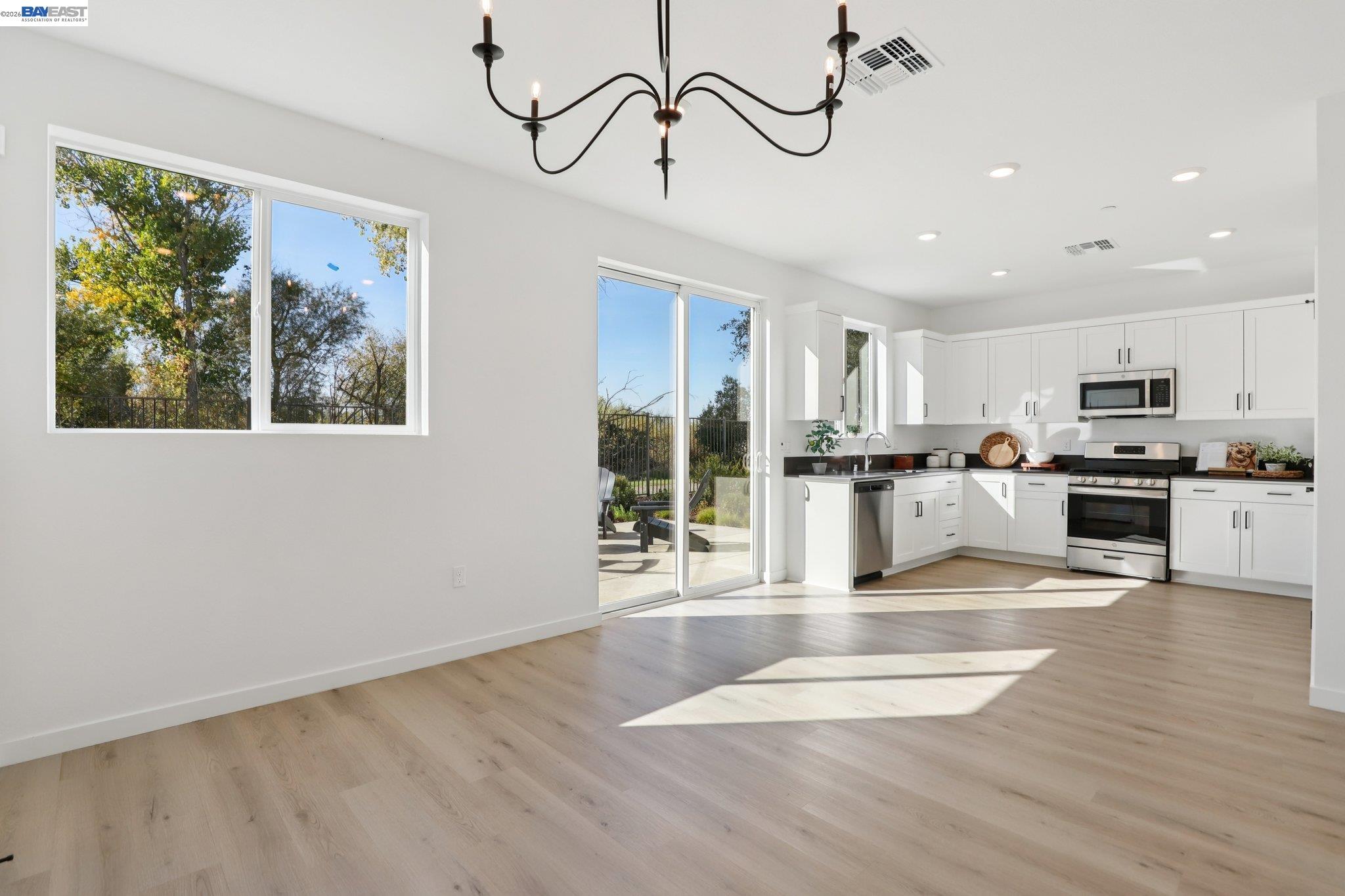 856 Pecan Tree Lane Galt, CA 95632 - Photo 9 of 30 a view of a kitchen with furniture and windows