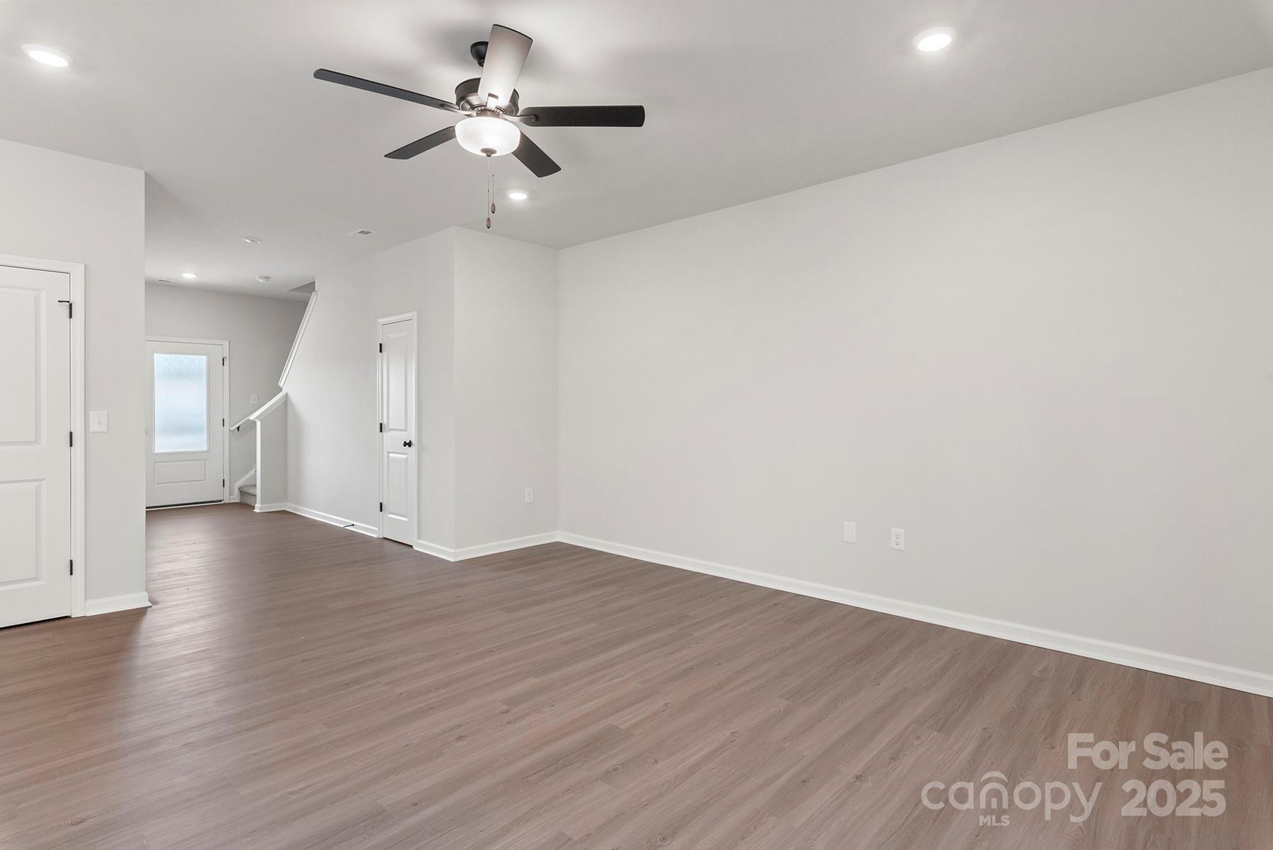 3350 Strong Gastonia, NC 28052 - Photo 2 of 25 an empty room with wooden floor and ceiling fan