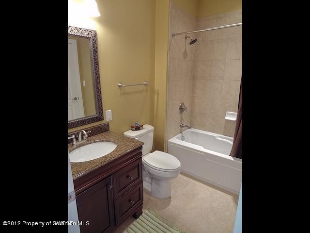 16 Windy Drive Shavertown, PA 18708 - Photo 17 of 22 a bathroom with a double vanity sink toilet mirror and shower