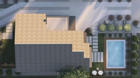 a brick house with a potted plant on it