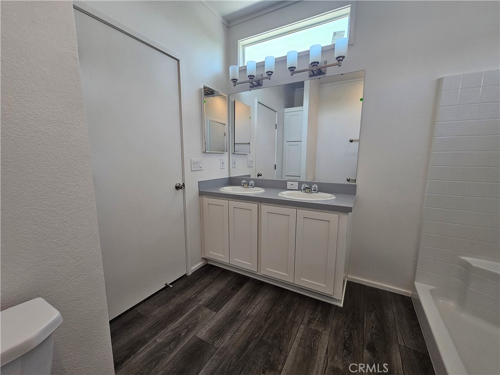 999 South Santa Fe Avenue, Unit 35 San Jacinto, CA 92583 - Photo 11 of 20 a bathroom with a sink and a mirror