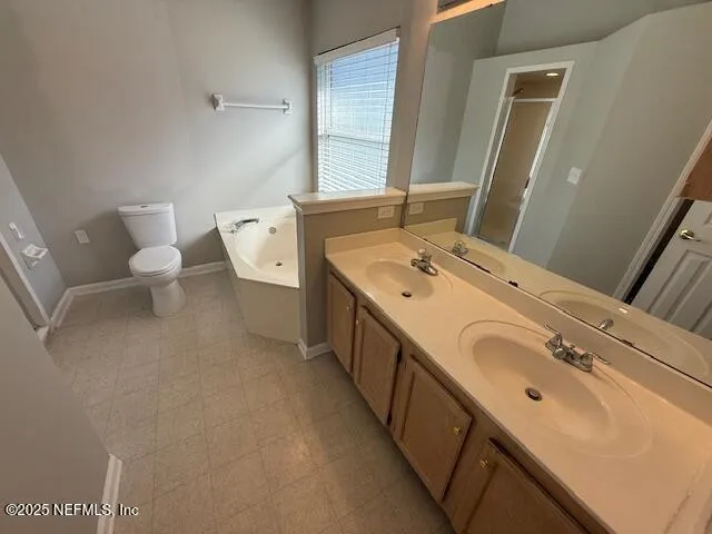 a bathroom with a double vanity sink and mirror
