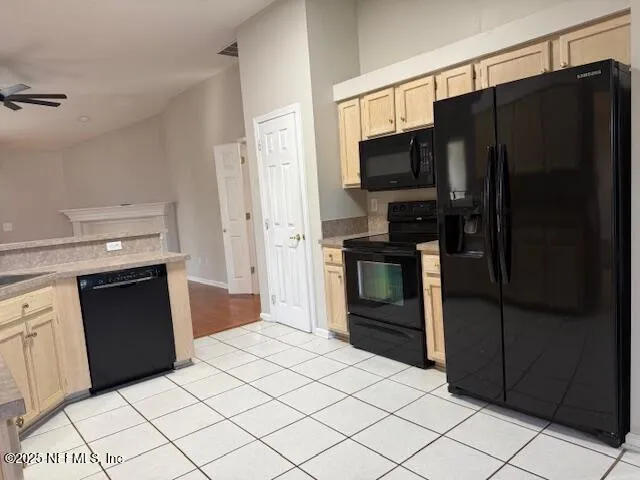 a kitchen with granite countertop a refrigerator and a stove