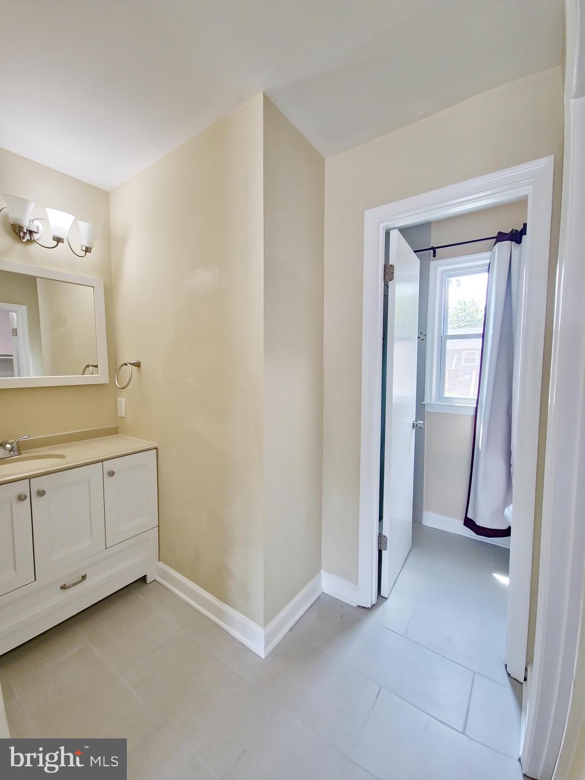 6808 Ben Franklin Road Springfield, VA 22150 - Photo 24 of 34 a view of a utility room with closet and mirror
