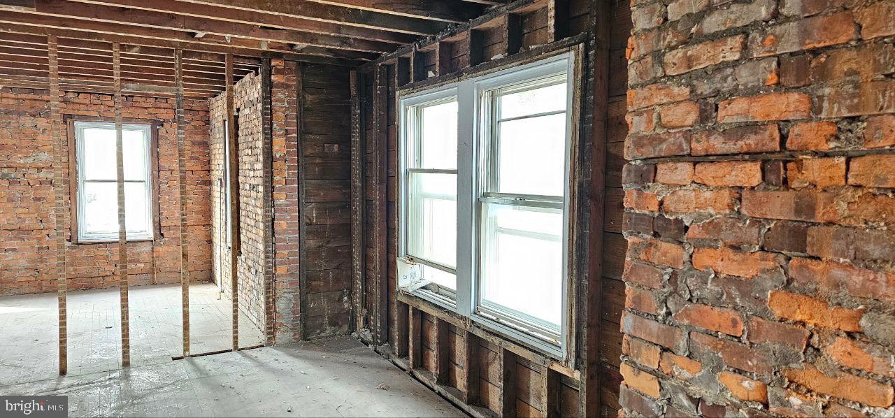 235 East County Line Road Ardmore, PA 19003 - Photo 9 of 16 a view of a large room with wooden floor and windows