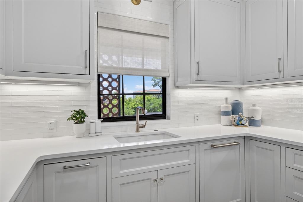 106 South Interlachen Avenue, Unit 518 Winter Park, FL 32789 - Photo 25 of 58 a kitchen with a sink and cabinets