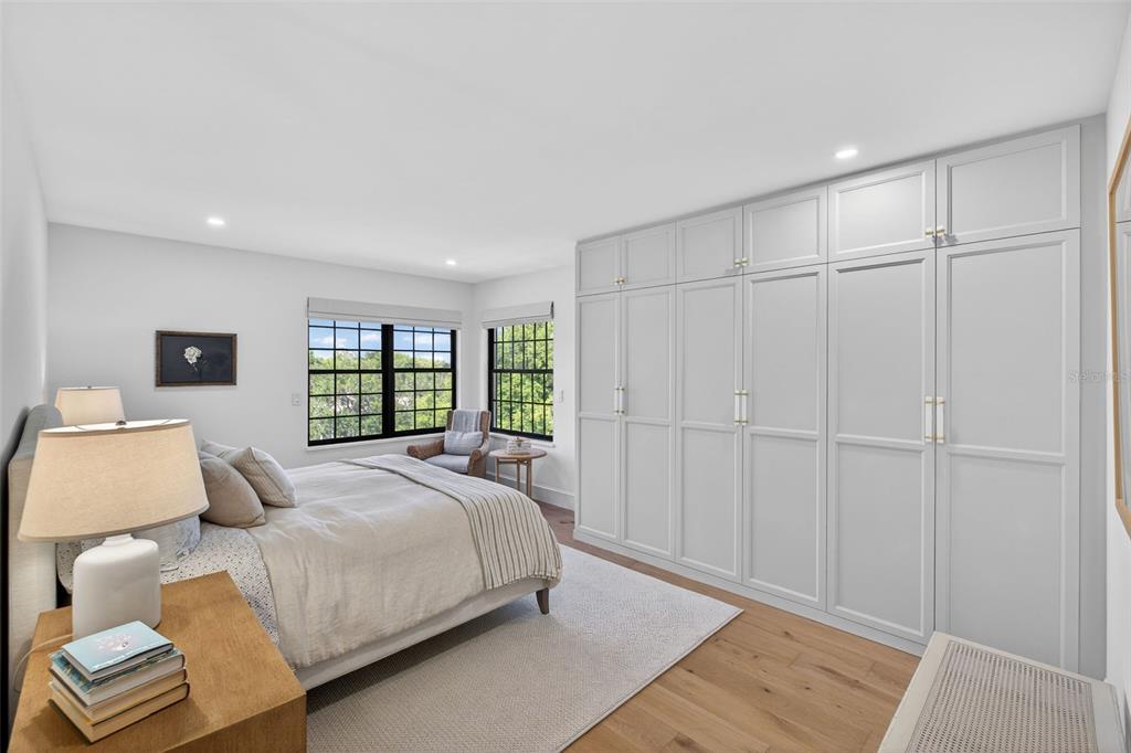106 South Interlachen Avenue, Unit 518 Winter Park, FL 32789 - Photo 28 of 58 a bedroom with a large bed and a window