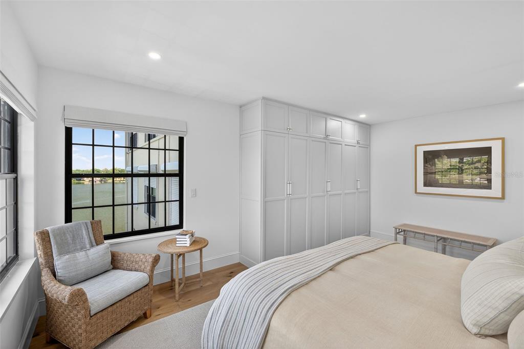 106 South Interlachen Avenue, Unit 518 Winter Park, FL 32789 - Photo 31 of 58 a bedroom with a bed and a couch