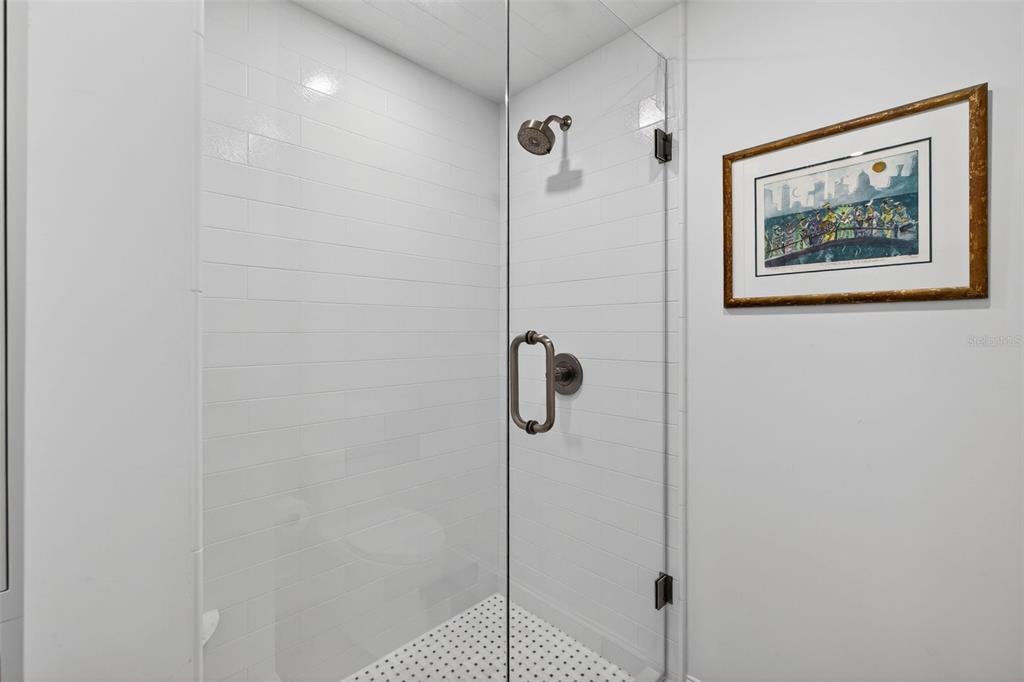 106 South Interlachen Avenue, Unit 518 Winter Park, FL 32789 - Photo 38 of 58 a bathroom with a shower