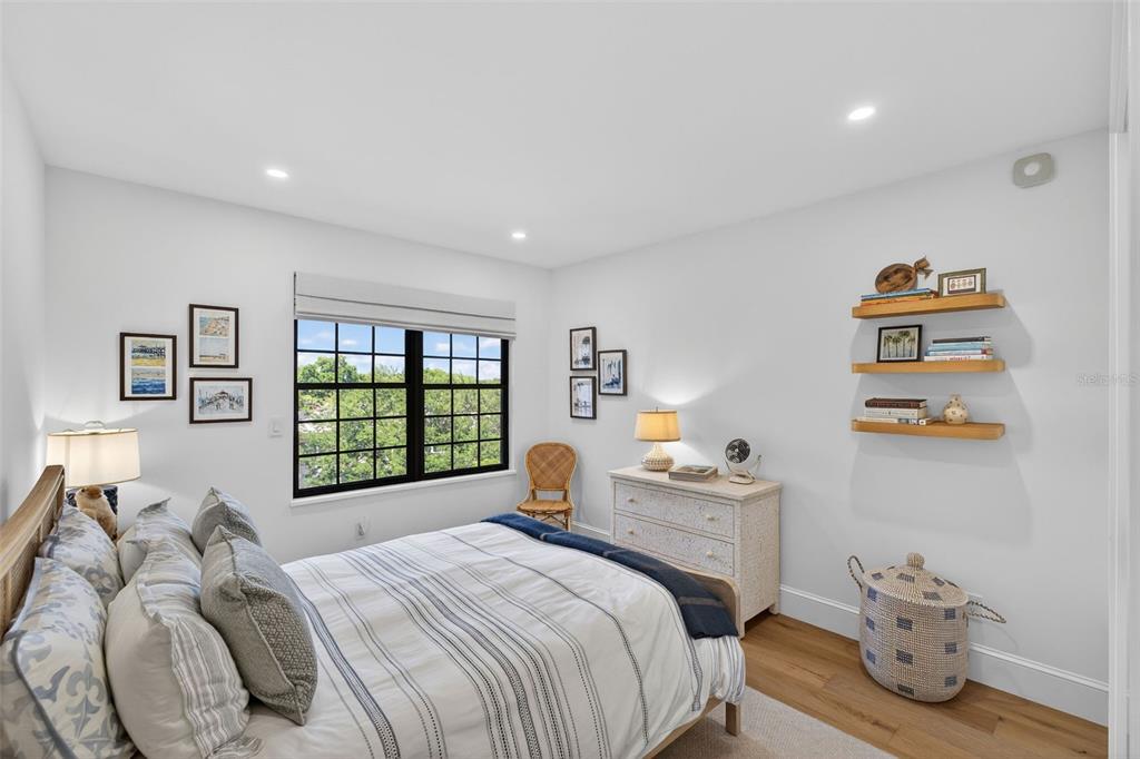 106 South Interlachen Avenue, Unit 518 Winter Park, FL 32789 - Photo 39 of 58 a bedroom with a bed and a window