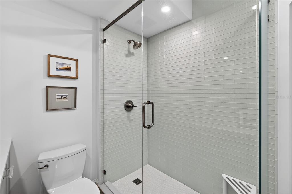 106 South Interlachen Avenue, Unit 518 Winter Park, FL 32789 - Photo 41 of 58 a bathroom with a toilet and a shower