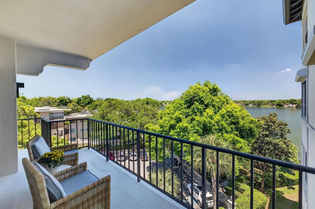 106 South Interlachen Avenue, Unit 518 Winter Park, FL 32789 - Photo 6 of 58 a view of a balcony with couches wooden floor
