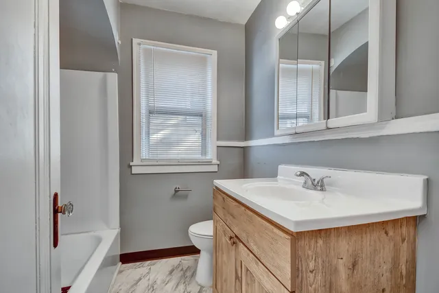 a bathroom with a sink and a toilet