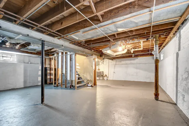 a view of an empty room with wooden walls