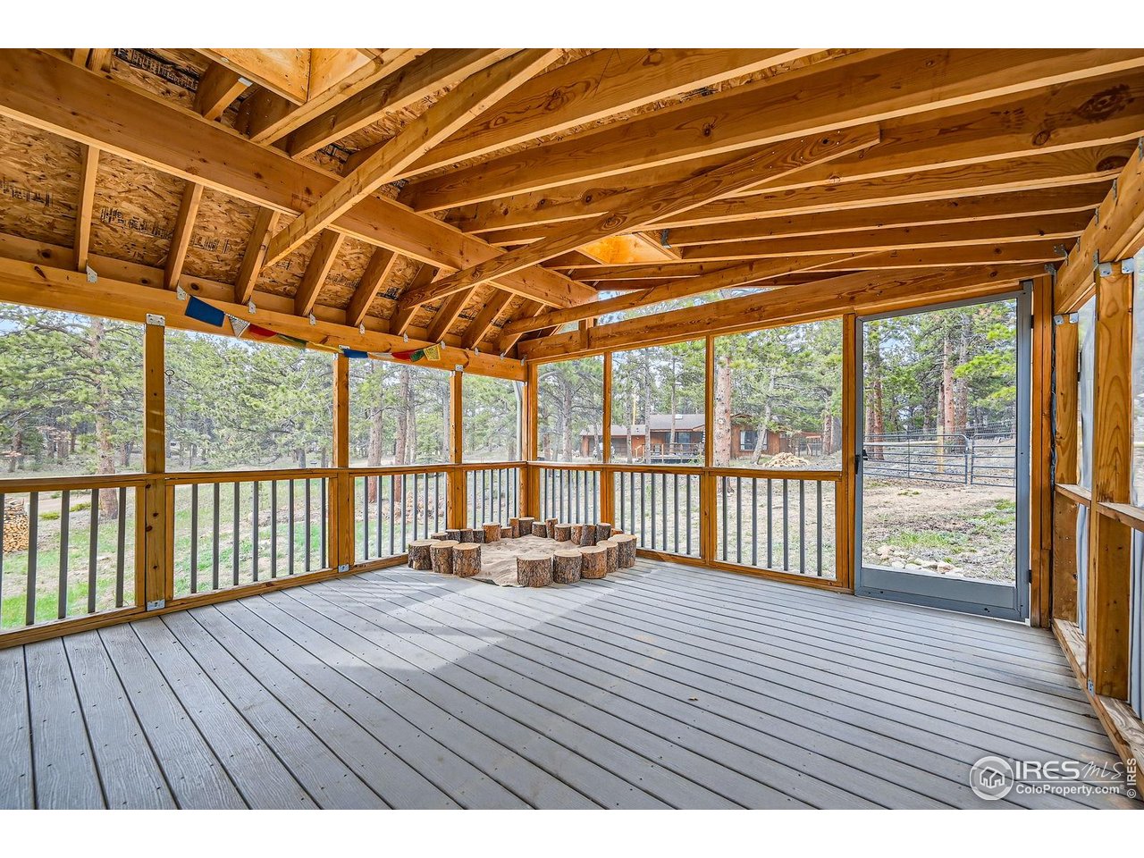 613 Ranch Road Ward, CO 80481 - Photo 15 of 37 Fully screened porch on the north side of the home - perfect place to keep cool on a summer day