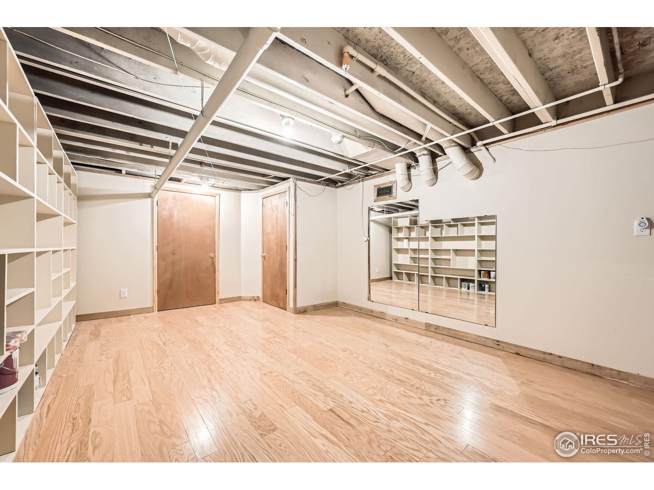 613 Ranch Road Ward, CO 80481 - Photo 18 of 37 Downstairs flex area as you walk in from the garage - makes a great storage or workout space!