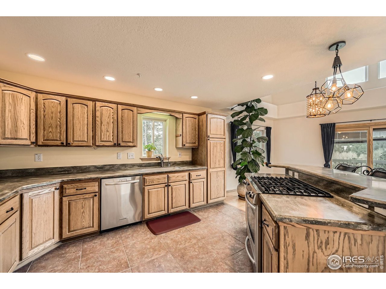 613 Ranch Road Ward, CO 80481 - Photo 8 of 37 Stainless, gas range/oven and loads of counter and cabinet space