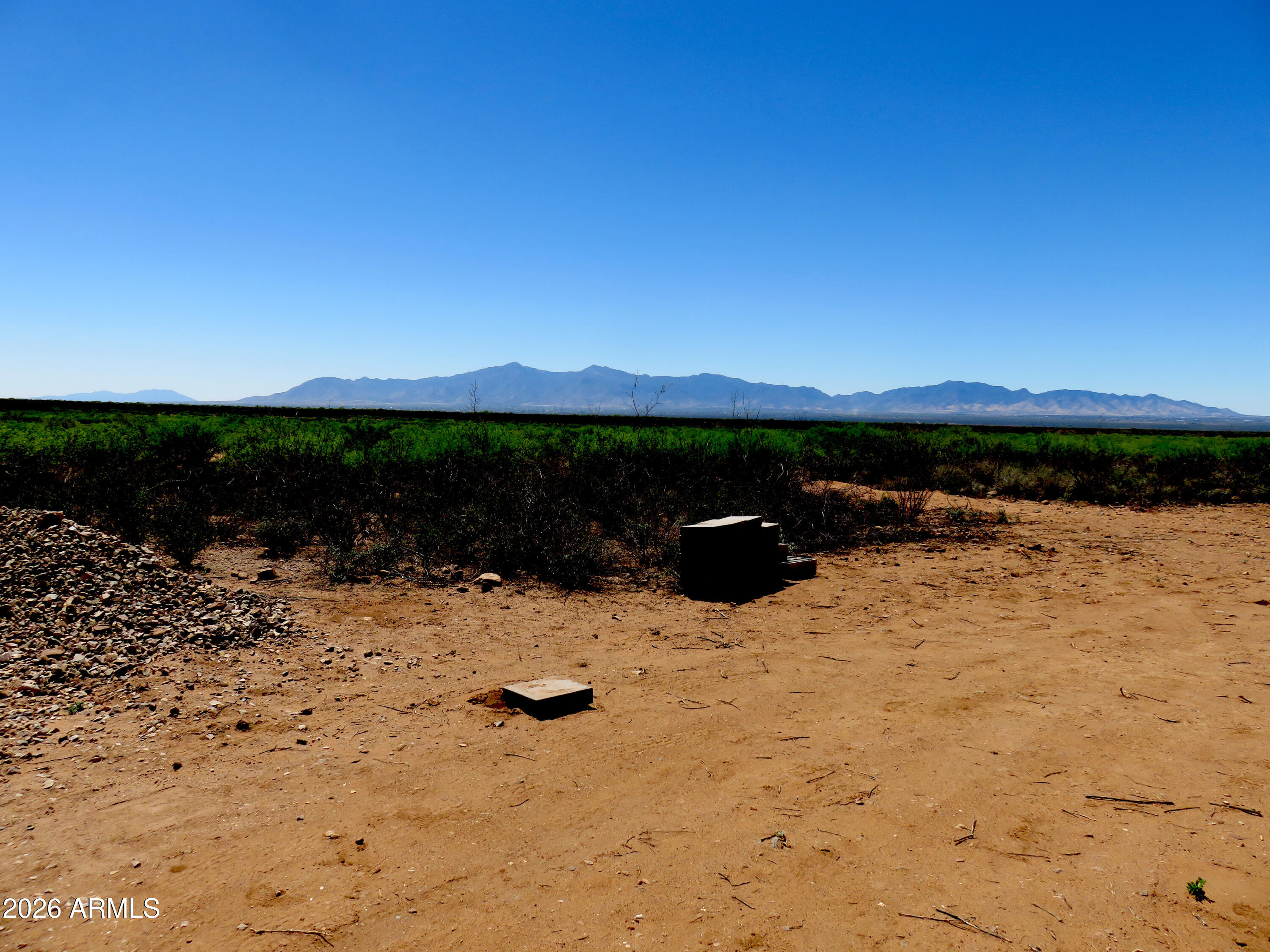 917 East Stonebraker Road, Unit A Tombstone, AZ 85638 - Photo 3 of 6 a view of a lake with a mountain
