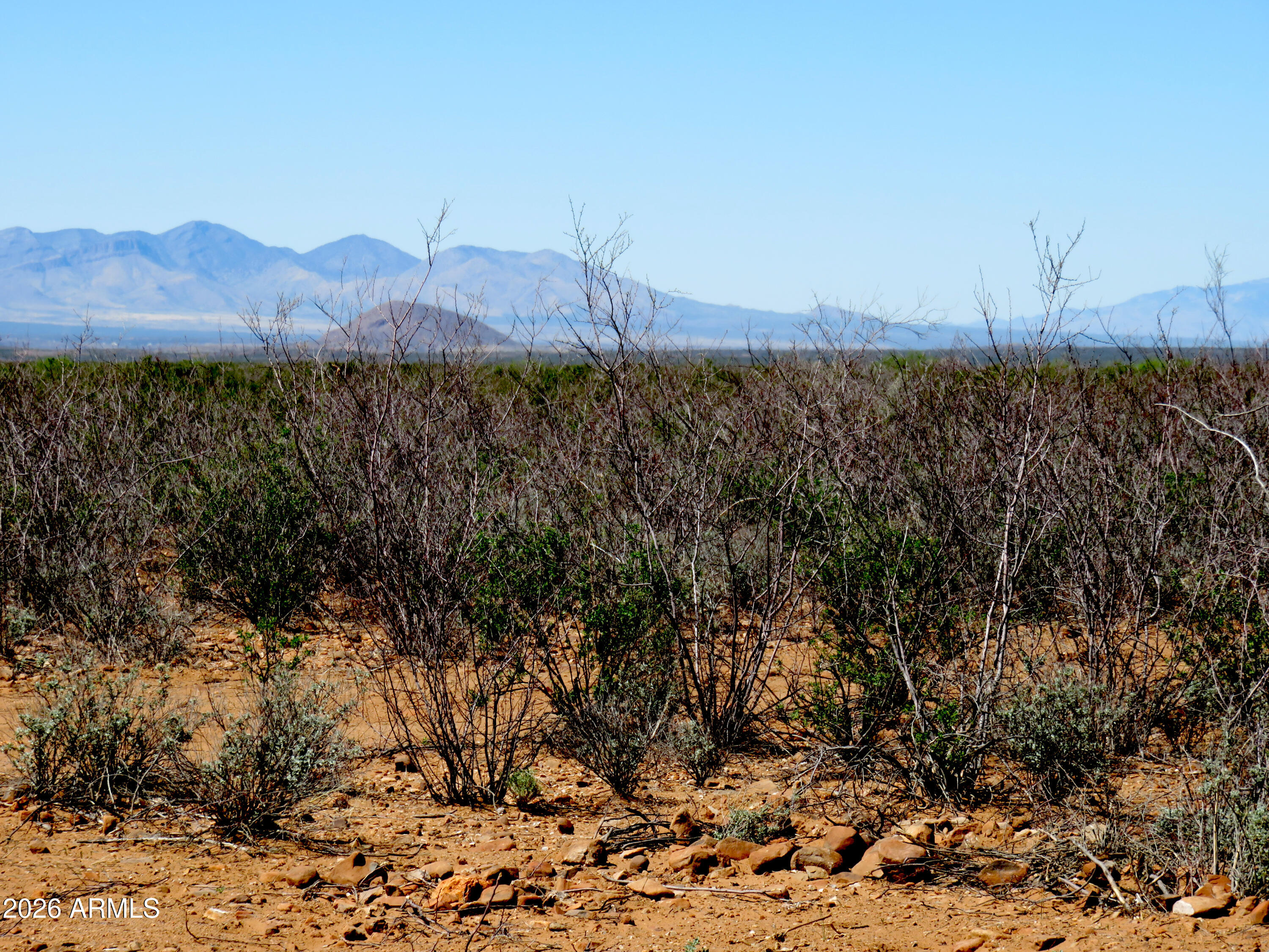 917 East Stonebraker Road, Unit A Tombstone, AZ 85638 - Photo 5 of 6 a view of a town with mountains in the background