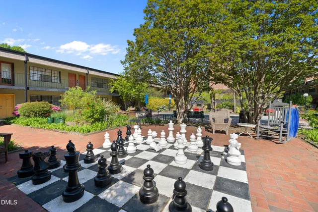 a view of a chairs and tables in patio