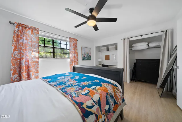 a bedroom with a bed and a dresser