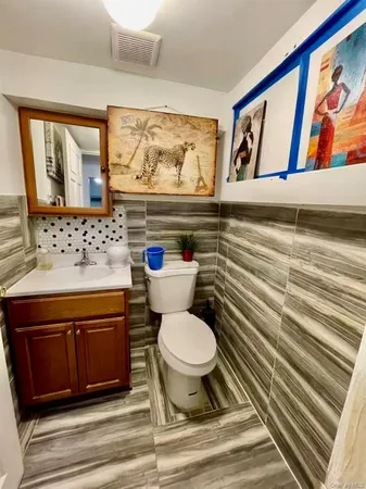 a bathroom with a toilet and a sink