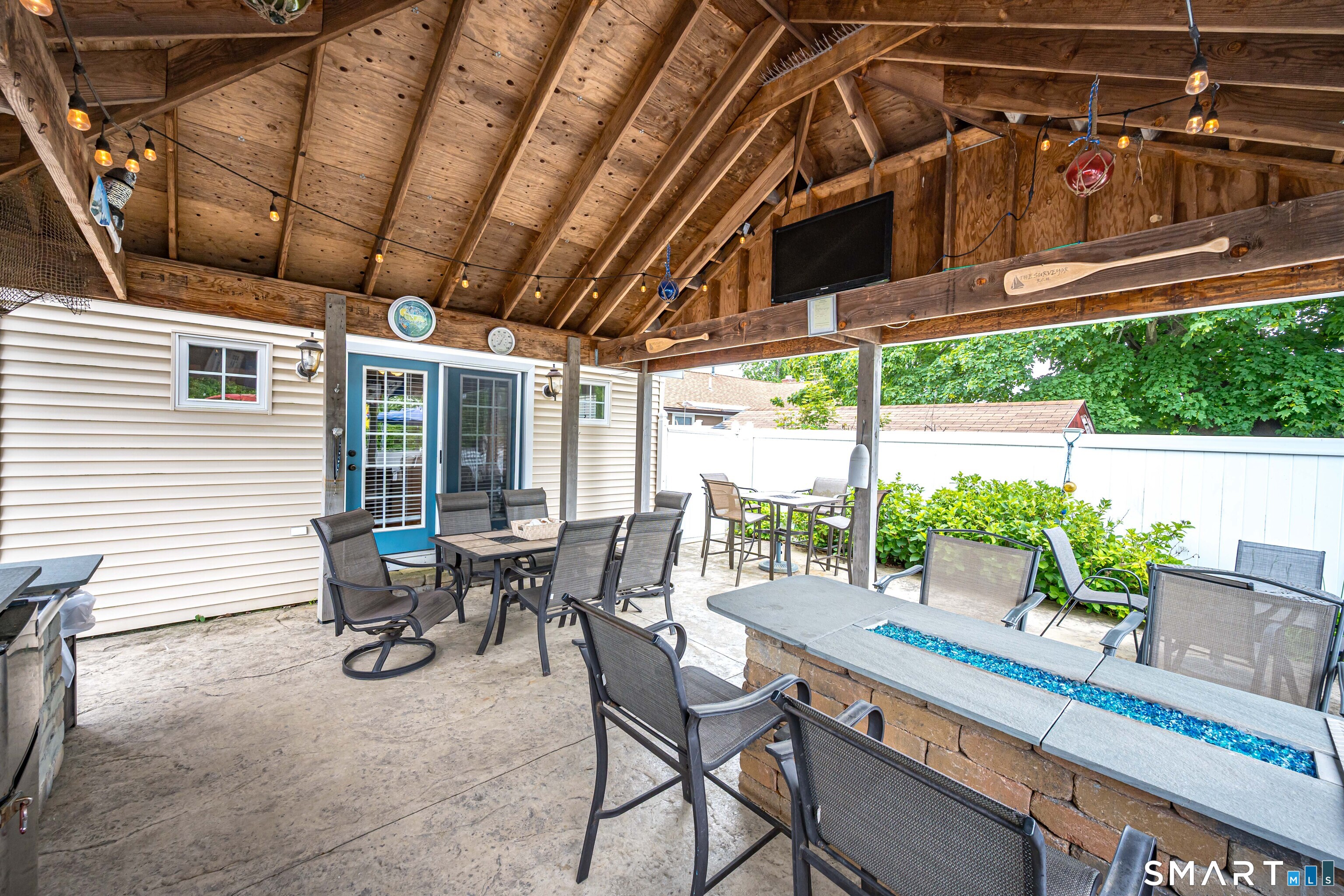 58 Minor Road East Haven, CT 06512 - Photo 24 of 40 Covered Patio off the back of the house. French doors lead to primary suite. Gas Fire Table/Bar