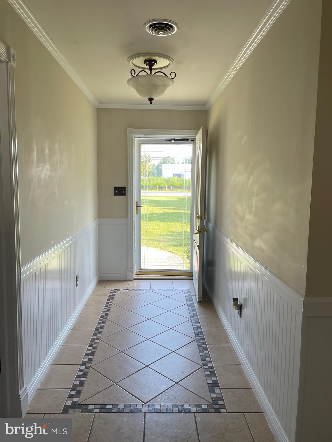 27665 Nanticoke Road Salisbury, MD 21801 - Photo 12 of 20 Elegant foyer with tile floors and French doors