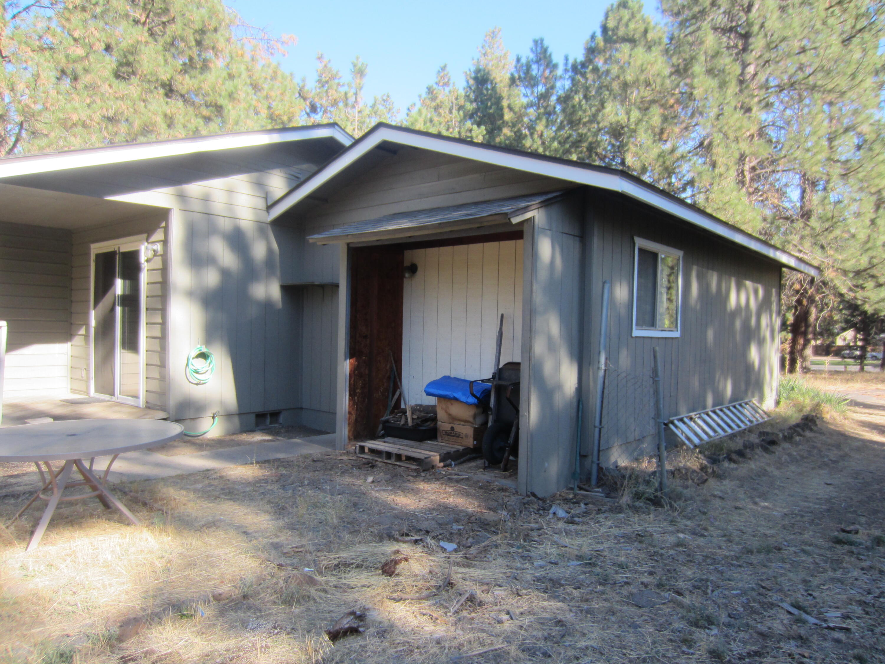 60313 Cinder Butte Road Bend, OR 97702 - Photo 11 of 20 Wood storage in back of the garage