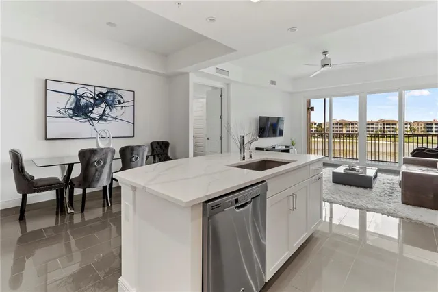 a kitchen with a table chairs stove and cabinets