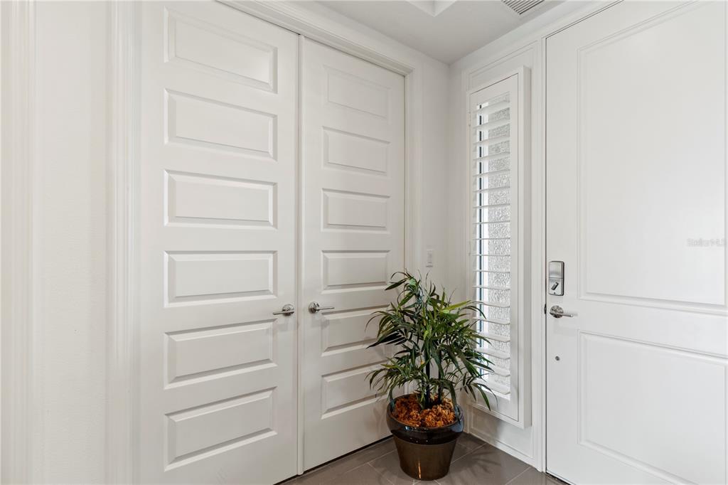 10520 Boardwalk Loop, Unit 302 Bradenton, FL 34202 - Photo 31 of 45 a potted plant in front of a door