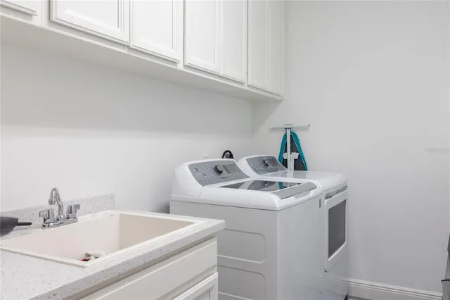 a bathroom with a sink and cabinets